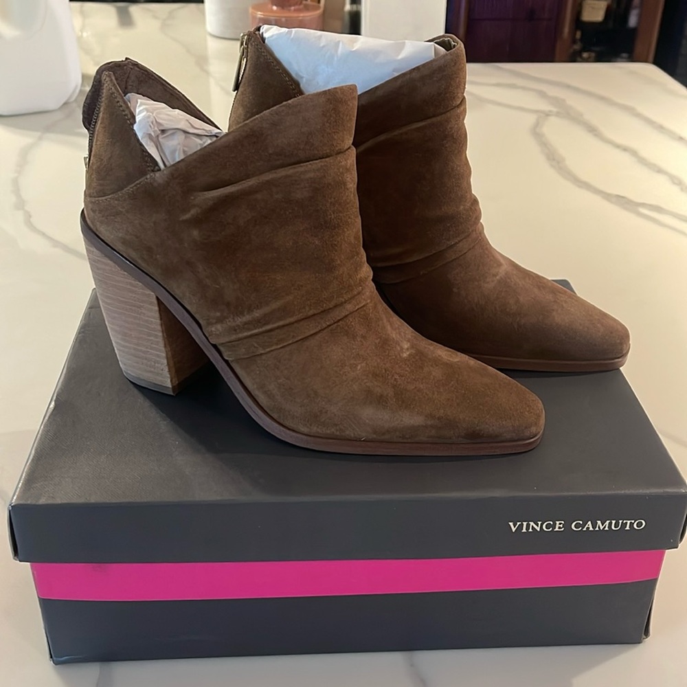 Vince Camuto tan booties with small zipper on the heel.
